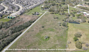 An aerial photo looking down at Williams Prairie surrounded by suburban development in west Houston.